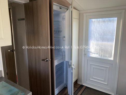 Primrose valley 2 Bedroom 6 Berth caravan hire Full height fridge freezer view