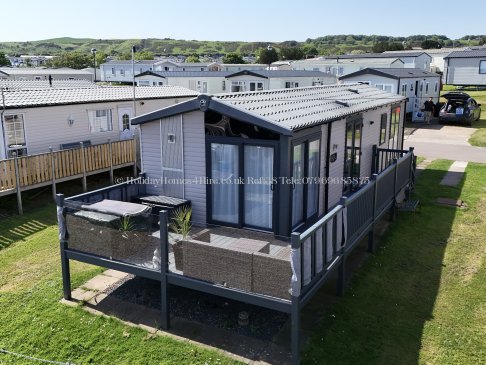 Side view of 2-bedroom lodge for hire at Haven Holidays Reighton Sands – ref 38