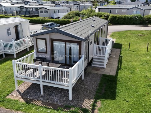 Exterior view of 2-bedroom caravan for hire at Reighton Sands – ref 54