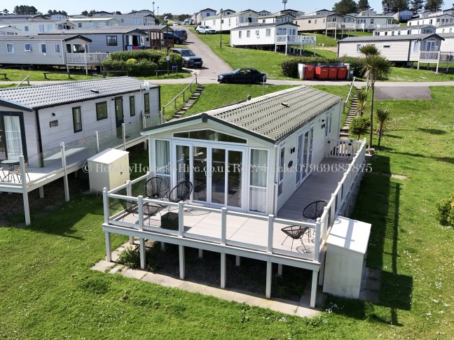 Front exterior view of sea view lodge at Reighton Sands – ref 74