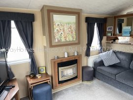 Haven Holidays Primrose Valley 3 Bedroom caravan fireplace Ref19
