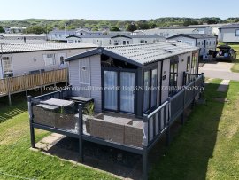 Side view of 2-bedroom lodge for hire at Haven Holidays Reighton Sands – ref 38