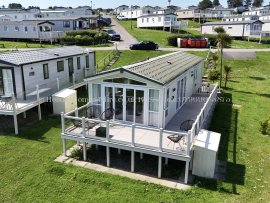 Front exterior view of sea view lodge at Reighton Sands – ref 74