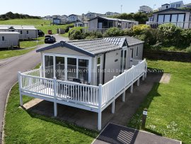 Front exterior view of sea view lodge at Reighton Sands – ref 43