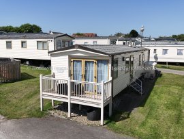 Front view of 3-bedroom caravan for hire at Reighton Sands – ref 73